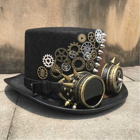 A Victorian-style hat with Steampunk elements like cogs and gears The goggles are included with the hat! Steampunk top hat for men and women Special use: costume or cosplay Material: wool, polyester  Circumference: 22.4" | 57cm Height : 5.1" | 13cm Looking for something similar? Embark on an adventure with our Steampun Cogs And Gears, Steampunk Elements, Moda Steampunk, Steampunk Top, Steampunk Artwork, Mode Steampunk, Steampunk Couture, Steampunk Aesthetic, Steampunk Top Hat