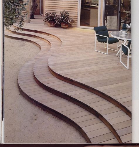 Wooden decks can be an immediate extension of a house or a remote space overlooking a particularly spectacular vista and be designed in many shapes and sizes.  This one bows where it needs to, where a table and chairs need more room than circulation. Curved Patios, Decking Path, Curved Decks, Round Terrace, Curved Decking, Wood Deck Steps, Wood Deck Designs, Curved Deck, Curved Patio