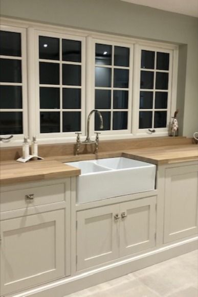 This stunning country style kitchen has hand painted cream beaded cabinets. The exposed brick wall creates a focal point and the owner has opted not to have any wall cabinets because of this. With wooden worktops, planted plinths and a huge larder it's a beautiful space to entertain in #countrykitchen #creamkitchen #handmadekitchen Beige Kitchen Walls, Beige Kitchen Paint, Color Scheme Kitchen, Kitchen Cabinets Beige, Beige Kitchen Decor, Cream Country Kitchen, Beige Kitchen Ideas, Beige Kitchen Cabinets, Cream Kitchen Cabinets