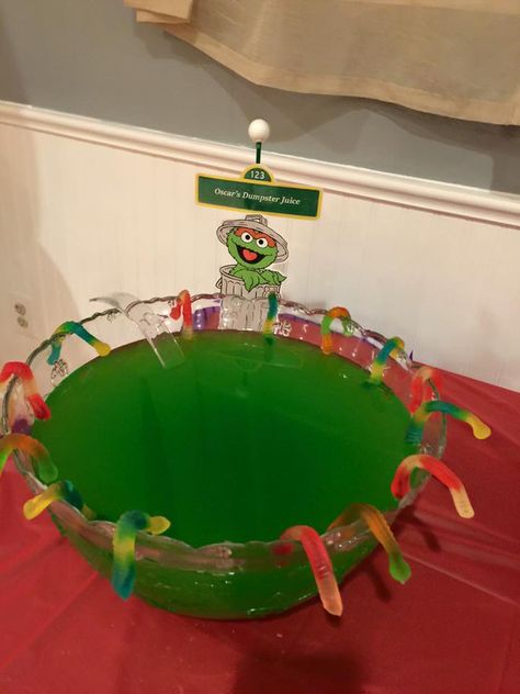 Oscars dumpster juice -Hawaiian punch (green)  Gummy worms Large bowl  Hand made sign Sesame Street Birthday Party Ideas Boy, Elmo Birthday Party Boy, Elmo Birthday Party, Hawaiian Punch, Sesame Street Birthday Party, Elmo Party, Sesame Street Party, Oscar The Grouch, Elmo Birthday