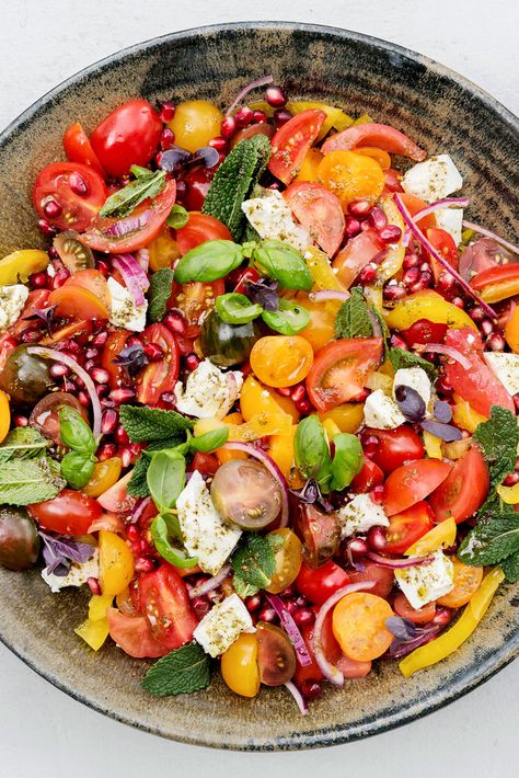 NYT Cooking: Here is a dish that melds the best flavors of summer into a robust salad. Yotam Ottolenghi calls for cherry tomatoes, but summer’s best tomatoes would also be right at home among the feta, mint and za’atar, the Middle Eastern spice blend. Serve it alongside grilled meat, preferably in the back yard, summer nipping at the heels. Pomegranate Recipes Salad, Ottolenghi Recipes, Pomegranate Salad, Yotam Ottolenghi, Nyt Cooking, Middle Eastern Recipes, Grilled Meat, Summer Salads, Delicious Salads