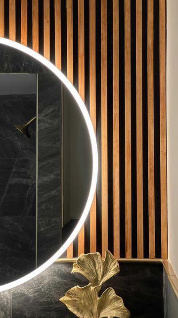 Bathroom Vanity Feature Wall, Slat Wall Bathroom Vanity, Wood Slate Accent Wall Bathroom, Wood Behind Bathroom Mirror, Black And Walnut Bathroom, Wood Slat Bathroom Ceiling, Wood And Black Bathroom Ideas, Black Bathroom Vanity With Wood Top, Wood Slats Bathroom Wall