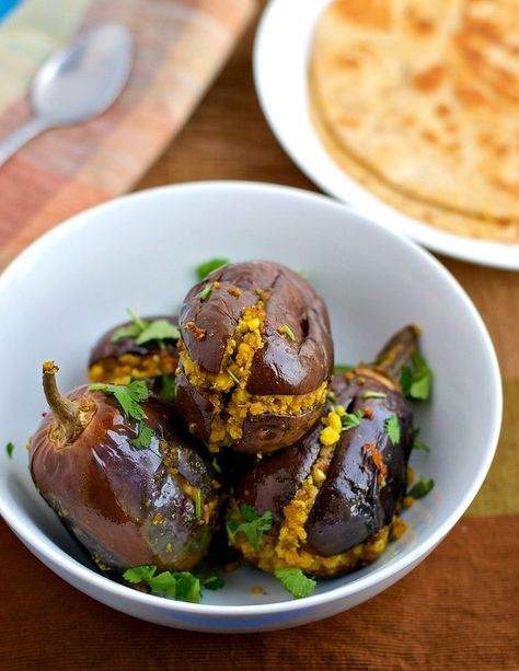 Bharva Baingan - Brinjal or eggplant stuffed with a spicy peanut and gram flour filling is no ordinary dish. It will tingle your taste buds in a way that you will keep craving for it. Thankfully you can make them in 30 minutes! Eggplants Recipe, Authentic Indian Food, Stuffed Eggplant, Eggplant Recipe, Healthy Indian Recipes, Eggplant Dishes, Indian Vegetarian Recipes, Ethnic Food, Eggplant Recipes