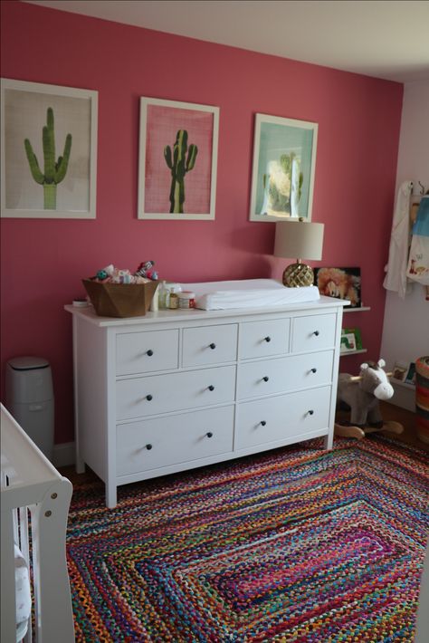 Mexican decor nursery. Pink wall, cactus prints, Ikea dresser, crib Book corner. Baby decor Pink Cactus Nursery, Bright Pink Nursery Ideas, Mexican Style Nursery, Mexican Nursery Theme, Mexican Themed Nursery, Mexican Nursery Decor, Mexico Nursery, Hot Pink Nursery, Bright Pink Nursery