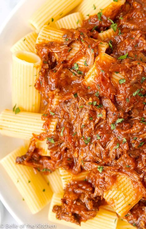 This incredibly delicious Beef Ragu is braised in the slow cooker for the ultimate cozy meal. The tender, rich beef is slow cooked with tomatoes, herbs, and red wine, then served over hearty noodles for a restaurant-worthy dinner made at home. #beef #ragu #dinner #crockpot belleofthekitchen.com Crockpot Ragu Braised Beef, Slow Cooker Beef Ragu 12 Tomatoes, Beef Ragu Slow Cooker, Shredded Beef Ragu, Slow Cooker Lasagne, Spaghetti Sauces, Beef Ragu Recipe, Beef Rump Roast, Beef Tips And Noodles