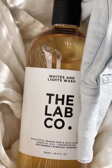 Image featuring The Lab Co. Whites & Lights Laundry Detergent bottle nestled in between a white linen shirt and light blue denim-look shirt Eco Laundry, Laundry Detergent Bottles, Eco Friendly Laundry Detergent, Detergent Brands, Detergent Laundry, Spa Interior Design, Detergent Bottles, Spa Interior, Orange Rind