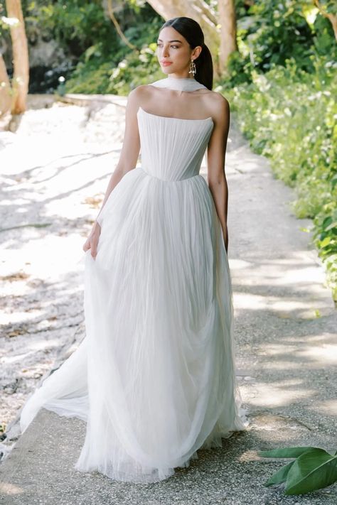 Watters Style #67411B. 
                        Introducing Reko, a wedding dress that reimagines the classic ballgown. The soft net tie and Georgian-style corsetry adds a touch of romance and structure, resulting in a creation that's as unique as it is elegant. Crafted from soft netting, this gown embodies contemporary style while paying homage to the timeless charm of a ballgown silhouette. The dainty and delicate tucks add an element of intrigue. These tucks are a nod to modern design sensibilities, adding a touch of uniqueness to the classic ballgown shape.
                    <div class="expandable-block-overlay" style="display: block; width: 100%; height: 36.431999px; position: absolute; bottom: 0px; right: 0px; transition: max-width 1s ease 0s; background-image: linear-gradient(to r Watters Wedding Dress, Watters Bridal, Moonage Daydream, Full Gown, Corset Gown, Bridal Gallery, 2025 Wedding, Ethereal Wedding, Bridal Robe