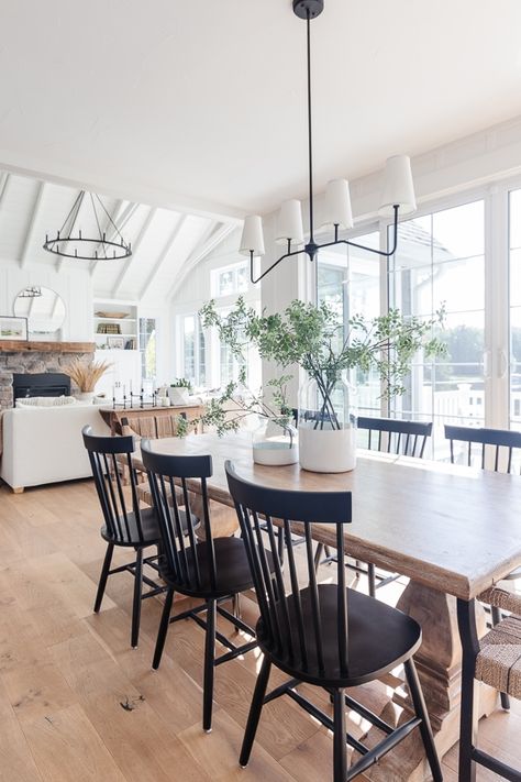 wood table with black chairs and white vases Black Kitchen Chairs, Coastal Dining Room, Black Chairs, Coastal Dining, Kitchen Table Wood, Black Dining Chairs, Black Dining Room, Beautiful Dining Rooms, Furniture Office