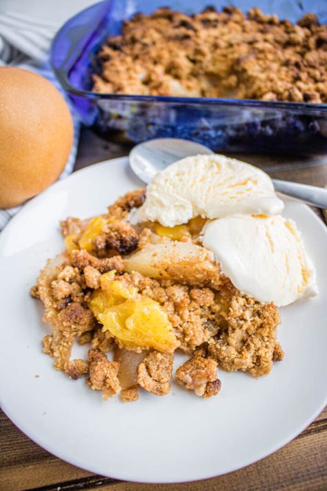 Mango Pear Crisp is a refreshing dessert, full of fresh fruit coated in cinnamon and sugar, and topped with oat graham crumble. #ad #mango #pearcrisp #SweetBeginningsBlog #SpringSweetsWeek #dessert #melissasproduce #nairns #dixiecrystals Mango Crumble, Mango Coulis, Baking Lessons, Pear Crisp, Mango Recipes, Refreshing Desserts, Apple Pear, Crumb Topping, Baking Set