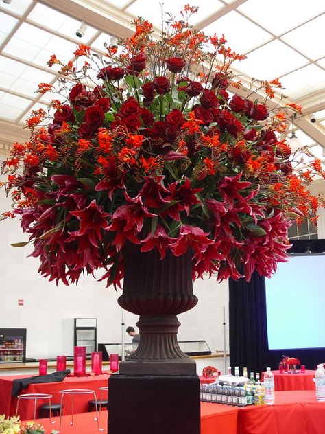 Dramatic red flowers in a large room arrangement. Hotel Flower Arrangements, Red Flower Arrangements, Red Rose Arrangements, Room Arrangement, Hotel Flowers, Rose Floral Arrangements, White Flower Arrangements, Altar Arrangement, Large Flower Arrangements