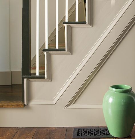 A sideview of white-painted stairs with white spindles and black handrail. Staircase Paint, Traditional Paint Colors, Tyler Gray, Modern Farmhouse Pantry, Interior Wall Colors, Modern Farmhouse Table, Beautiful Entryways, Colonial Style Homes, Traditional Paint