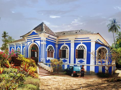 Casa Robello, Anjuna, Goa, Built in 16th Century. This royal blue Goan house is classic due to its characteristic balconies. The seats along the length of the porch are L-shaped and made from expensive wood. The windows have brightly coloured stained glass and contrasting it are lightly tinted flint glass that are no longer made in such a creative manner Goa Portuguese, Portuguese Houses, Goa Travel, Home Gym Design Garage, Casas Coloniales, Traditional Houses, Colonial Architecture, Indian Architecture, Grand Staircase