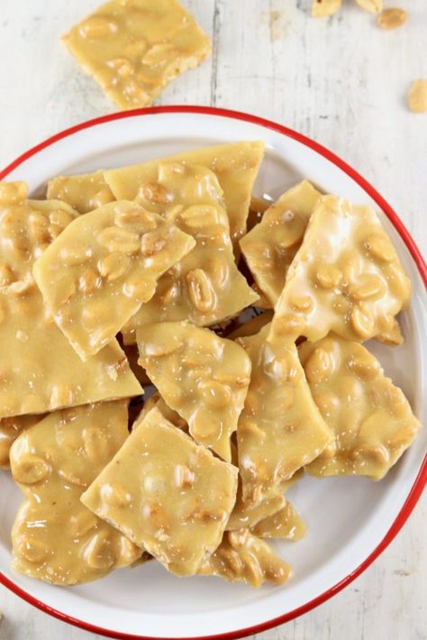 Easy Peanut Brittle recipe is the classic we all love. Just like grandma would make every Christmas! This simple recipe comes together in about 15 minutes and will be a holiday staple for years to come! Cookie Brittle Recipe, Easy Peanut Brittle, Easy Peanut Brittle Recipe, Cookie Brittle, Holiday Candy Recipes, Peanut Brittle Recipe, Easy Christmas Candy Recipes, Coleslaw Recipe Easy, Canned Butter