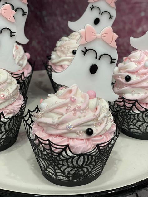 Pastel Fall Birthday Party, Halloween Bridal Shower Cake, Pink Ghost Cupcakes, Pink Ghost Halloween Party, Scary One First Birthday, Black And Pink Halloween Baby Shower Ideas, Spooky One First Birthday Centerpieces, Pastel Halloween Cupcakes, Spooky One Cupcakes