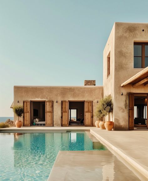 Perched on top of a hill, with its infinity pool looking at the Mediterranean. Minimalist lines, earthy tones, and open spaces that blend indoor and outdoor living areas. Welcome to C+A Residence in Greece. @giuseppe_sama_design_studio Meditarian House, Pueblo Style House, Pool Design Plans, Mediterranean Houses, Tuscan Architecture, Mediterranean House Design, Mediterranean Homes Exterior, Mediterranean Exterior, Minimal House