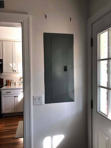 An Easy and Inexpensive Way to Cover up an Electrical Panel | That Homebird Life Blog | #homedecor #homehack #diy #mudroom Hide Electrical Panel Indoor, Diy Electrical Box Cover, Hide Electrical Panel, Bathroom Wall Coverings, Cover Electrical Panel, Electric Panel, Bathroom Towel Decor, Electrical Box Cover, Towel Decor