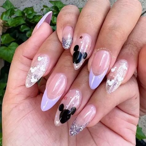 Garden Party Glam: Lavender Nail Art for Special Occasions #glaminati #nails #nailart #naildesigns #frenchnails #coffinnails #almondnails #ombrenails #gelnails #acrylicnails #trendynails #fallnails #purplenails #lavendernails #lilacnails #lavendercolor #lavenderpolishblands Glitter Disney Nails, Mickey Mouse Nail Design, Disney Themed Nails, Disney Princess Nails, Disney Christmas Nails, Disneyland Nails, Mouse Nails, Disney Nail Designs, Mickey Mouse Nails