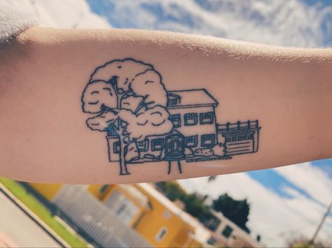 Fine line tattoo of house with front yard and tree on forearm Childhood House Tattoo, Fine Line House Tattoo, House Outline Tattoo, Childhood Home Tattoo, Address Tattoo, Cottage Tattoo, Small House Tattoo, House Tattoos, Baker Tattoo