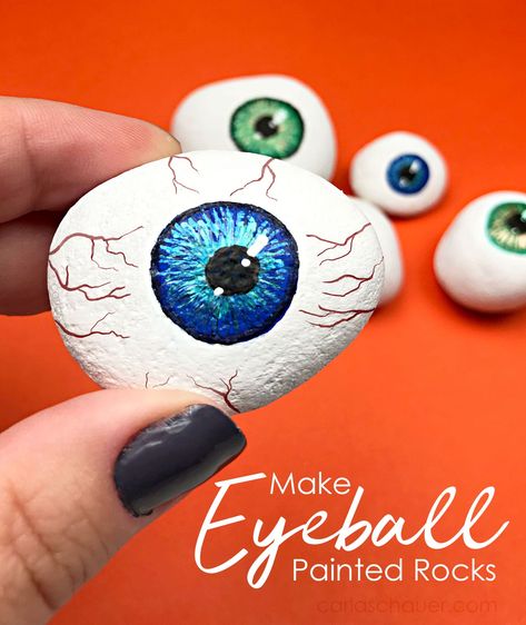 Halloween painted rock eyeball held in front of other painted eyeball rocks on orange background Halloween Vignette, Rock Painting Supplies, Halloween Fest, Halloween Rocks, Painted Rocks Kids, Painted Rocks Diy, Rock Painting Ideas Easy, Rock Painting Patterns, Halloween Painting