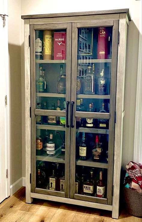 This new addition (cabinet) goes perfectly with our modern industrial great room. Bookcase turned whiskey cabinet. Whiskey Cabinet, Bourbon Room, Home Bar Rooms, Garage Bar, Bar Room, Bar Cabinet, Wine Bar, Displaying Collections, Display Cabinet