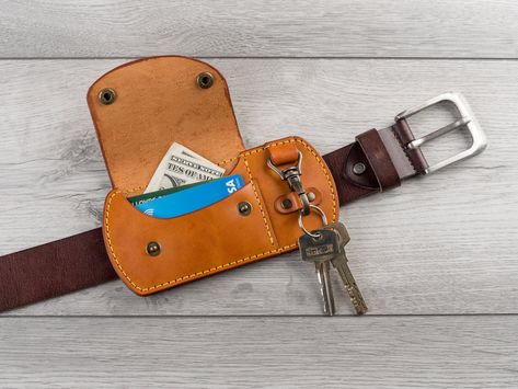 This belt wallet with key holder is made with natural bovine full grain leather. This is most abundant leather type that is used by maximum premium leather goods maker brands for producing moderate priced genuine leather items, This leather gives maximum value for money in terms of durability, elegance and texture. This product is 100% handmade: each leather hide is hand selected and the product has been hand cut, hand stitched, and hand finished. Made from 4-5 oz leather. This small belt wallet Belt Key Holder, Leather Knife Sheath Pattern, Diy Leather Working, Leather Working Projects, Belt Wallet, Diy Leather Projects, Leather Wallet Pattern, Leather Key Holder, Handmade Leather Belt