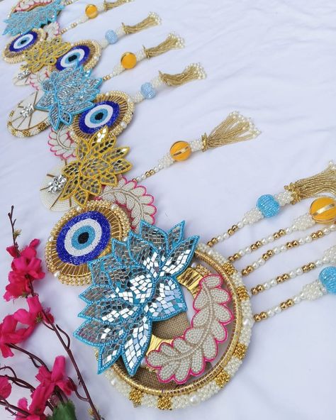 Evil eye Bandhanwar with mirror lotus 🪷🪷 beauty 😍 DM us for more details or Whatsapp us on 9867422790 Latest Bandarwal Designs, Bandarwal Designs, Arti Decoration, Toran Designs, Thali Decoration, Thali Decoration Ideas, Tissue Paper Flowers Diy, Heart Clip Art, Door Hanging Decorations