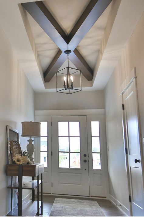 Adding some focal interest to the ceiling of this farmhouse was a fun project. Not an overwhelming detail but clean, strong lines bring some excellent character to this foyer. Tray Ceiling Foyer, Foyer Beams Entryway, Foyer Ceiling Design, Foyer Ceiling Ideas, Accent Ceiling Ideas, Entryway Ideas Modern, Modern Farmhouse Style Living Room, Foyer Ceiling, Bungalow Interior Design