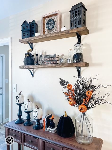 Halloween styled shelves Fall styled shelves Fall home decor Halloween decor Follow my shop @BlogsbyAria on the @shop.LTK app to shop this post and get my exclusive app-only content! #liketkit #LTKSeasonal #LTKhome #LTKHalloween @shop.ltk https://liketk.it/3PskE Halloween Decor For Shelves, Floating Shelf Fall Decor, Kitchen Shelf Fall Decor, Halloween Dresser Decor, Tv Stand Halloween Decor Ideas, Halloween Decor Shelves, Bookshelf Halloween Decor, Halloween Sofa Table Decor, Halloween Decor Tv Stand