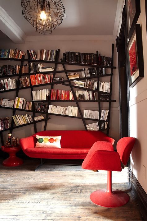 Our Cube could easily find a spot on that super awesome book shelf - Dovercourt Home by Stephane Chamard Modern Home Library, Contemporary Family Room, Koti Diy, Creative Bookshelves, Contemporary Living Room Design, Red Couch, Bookshelf Design, Home Libraries, Book Shelf