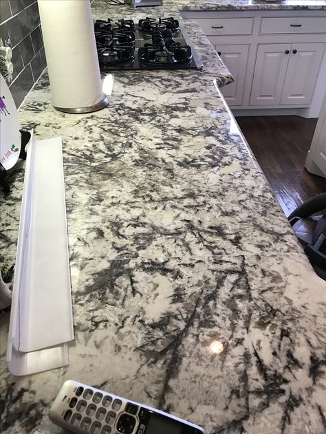 3cm Delicatus Supreme granite in remodel home kitchen countertops. Love this look. Countertops With Black Cabinets, Alaska White Granite Countertops, Epoxy Countertop Ideas, Backsplash Black Granite, Granite Countertops And Backsplash, Granite Countertops With White Cabinets, Kitchen Countertops Granite Colors, Delicatus White Granite, Alaska White Granite