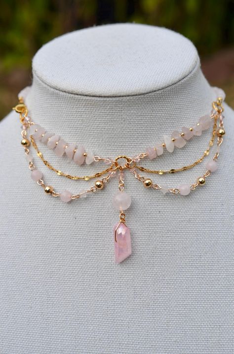 One of a kind Rose Quartz choker necklace. Made with 14k gold elements that will last. Message me for custom sizing, we are size inclusive! Raw Gemstone Jewelry Necklace, Rose Quartz Choker, Fairy Choker Necklaces, Gold Wire Necklace, Jewelry Making Aesthetic, Fairy Core Necklace, Ballroom Extravaganza, Fairy Choker, Gemstone Necklace Diy