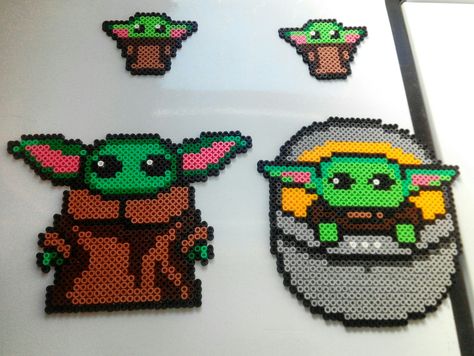 Hama baby yoda the child mandalorian Perler Mandalorian, Baby Yoda Perler Beads, Yoda Perler Beads, Christmas Baby Yoda, Melts Beads, Kandi Crafts, Anime Perler, Hama Beads 3d, Diy Disney Ears