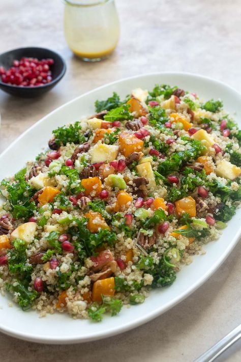 This Butternut Squash Quinoa Salad is fall in a bowl! It's packed with hearty quinoa, roasted butternut squash, crisp apple, kale and it's tossed in a sweet, tangy apple cider vinegar dressing. It's a satisfying fall salad that's gluten-free, vegan and great for meal prep! #salad #veganrecipes #quinoa Arugula Butternut Squash Salad, Squash Quinoa Salad, Apple Cider Vinegar Dressing, Cider Vinegar Dressing, Butternut Squash Quinoa Salad, Meal Prep Salad, Prep Salad, Quinoa Squash, Quinoa Salads