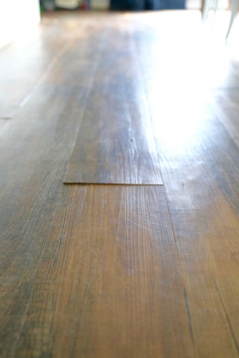 Can you believe that flooring is vinyl plank flooring? And that it cost under $2 per square foot? Here's a thorough review of Lowe's Style Selections luxury vinyl plank flooring, after living with it for more than 2 years Laying Vinyl Flooring, Glue Down Vinyl Plank Flooring, Floating Vinyl Flooring, Laminate Flooring Diy, Cheap Vinyl Flooring, Vinyl Wood Planks, Vinyl Wood Flooring, Kitchen Vinyl, Lvp Flooring