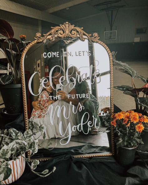 A recent review from the mother of the bride to be: "Everyone absolutely loved the mirror! It was just what we wanted. It added a special touch to the party! Thank you 🫶🏻" A hand lettered vintage mirror makes an elegant sign for a bridal shower or wedding. Did you know you can rent a gold framed mirror with custom lettering? Visit www.keturahstoltzfus.com and see all the mirrors available for your event. Glam Vintage Wedding, Bridal Shower Mirror Sign, Bridal Shower Mirror, Reception Mood Board, Mirror Signs, Winter Engagement Party, Mirror Wedding Signs, Gold Engagement Party, Wedding Body