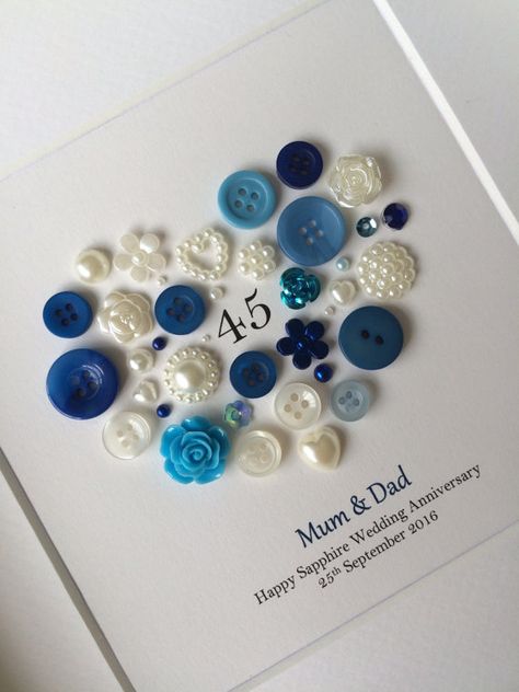 This personalised Sapphire Anniversary Button Art makes the perfect gift to celebrate 45 years of marriage. Made using buttons and embellishments in different colour blues and creams. Add your own message to make a truly personal gift - something that will be treasured for years to come. **Ordering Info** After youve added to cart there is a note to seller box where you can give me all the personalisation details you would like me to include on your artwork. Artwork comes in a 25cm x 25cm... 51st Wedding Anniversary, Diamond Wedding Anniversary Gifts, 45th Wedding Anniversary Gifts, 45th Anniversary Gifts, Wedding Anniversary Message, 65th Wedding Anniversary, Wedding Anniversary Party Decorations, 45th Wedding Anniversary, Sapphire Anniversary