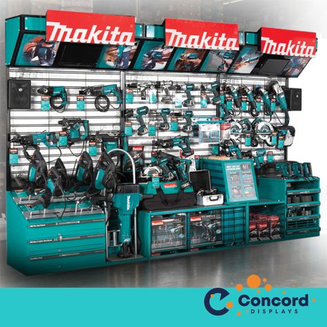 Does your retail display interact with all five of your customer's senses? This display we created was truly immersive. First, this display is an interactive touch and feel display. There are video screens at the top left and right, and Kicker speakers on each side (Makita partnered with Kicker speakers for this display). The Makita logos are lit up. Originally, Makita had 22 wire tool holders to hold all the types of tools they wanted to include in their display, but in the final version, we s Napa Auto Parts Store, Tool Display, Ryobi Power Tools, Power Tools Design, Power Tool Storage, Shop Facade, Japanese Woodworking, Bosch Tools, Tool Store