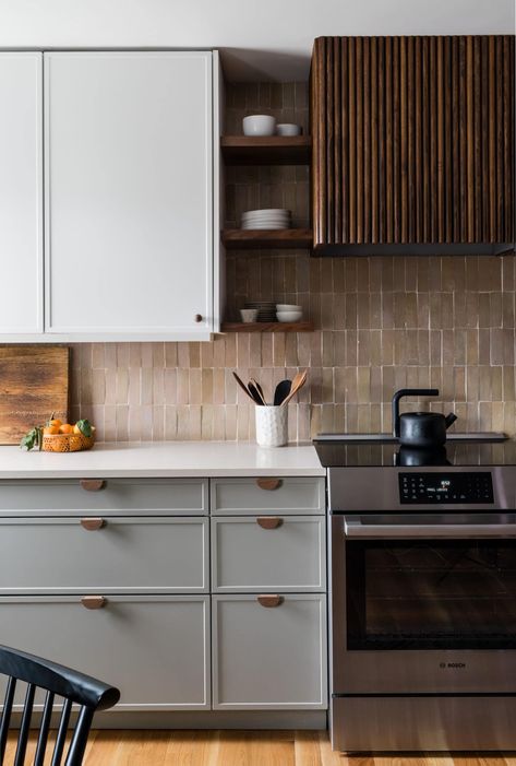 A Pennsylvania Kitchen Gets a Tranquil, Budget-Friendly Update Warm Modern Kitchen, Modern Kitchen Makeover, Statement Kitchen, White Kitchen Countertops, Walnut Floating Shelves, Builder Grade Kitchen, Walnut Kitchen, Two Tone Kitchen, Beige Tile