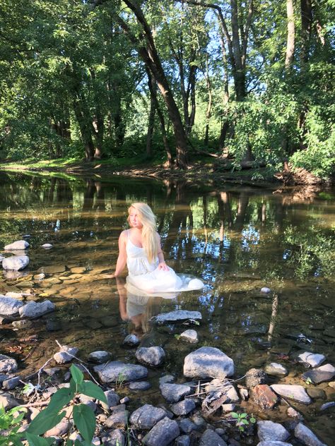 River photo shoot Boho Creek Photoshoot, River Shoot Ideas, Dress In Creek Photoshoot, River Dress Photoshoot, By The Water Photoshoot, Mystical Senior Pictures, Whimsigothic Photoshoot, Unique Senior Picture Ideas Water, Creek Photoshoot Outfit