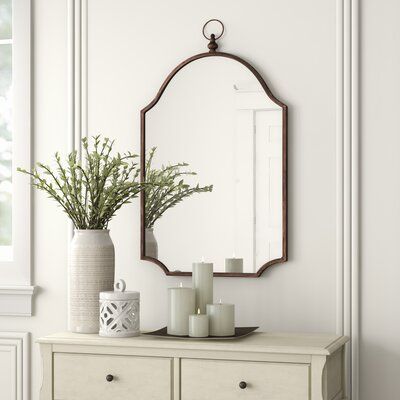 Three Posts™ This mirror features a metal frame with a shaped pendant top and scalloped bottom corners, finished in antiqued bronze. Antique Mirror Wall, Arched Mirror, Living Room Mirrors, Accent Mirror, Mirrors Wayfair, Wall Mounted Mirror, Accent Mirrors, Single Bathroom Vanity, House Of Hampton