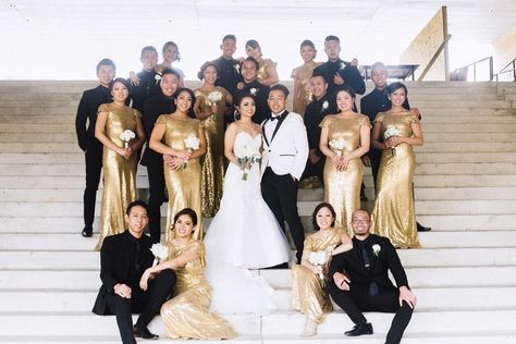 Black And Gold Nye Wedding, Black White And Gold Groomsmen, Black Tux With Gold Accents, Black White And Gold Bridesmaid Dresses, Black And Gold Bridal Party Attire, White And Gold Wedding Groomsmen, White And Gold Groomsmen Suits, Black Gold And White Wedding Theme Bridesmaid Dresses, Black And Gold Wedding Party Attire