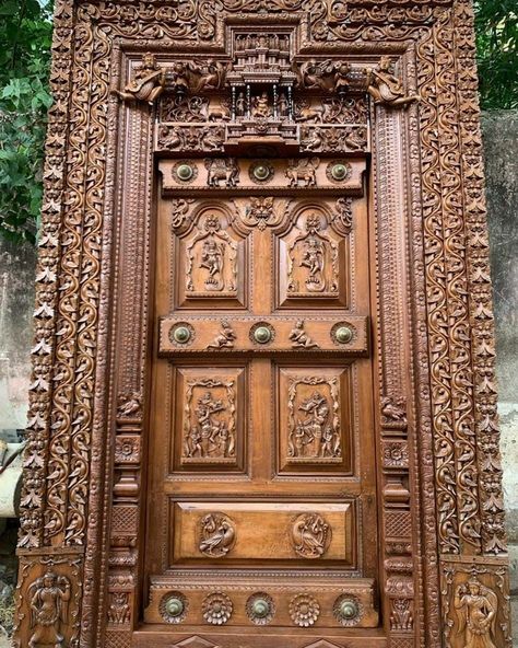 Teak wood intricate carved entrance door of Tamil Nadu style. Main Entrance Door Design Teak Wood, Door Images Wooden, Main Door Teak Wood Design Entrance, Carved Doors Wooden, Main Door Carving Design Entrance, Teak Wood Main Door Design Entrance Indian, Carving Door Design, Teak Wood Main Door Design, Teak Wood Main Door