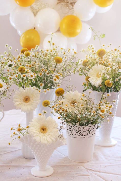 "To me, the secret to arranging daisies is a cheerful tangle of flowers that feels wild and fun. I used a combination of chamomile, baby’s breath, caspedia, wild daisies from my backyard, and white gerbera daisies in white vases." -Valerie McKeehan (author) What Is Drawing, Daisy Baby Shower Theme, Simple Flower Arrangements, White Gerbera, Daisy Theme, Daisy Decorations, Wild Daisies, Lily And Val, Daisy Baby Shower