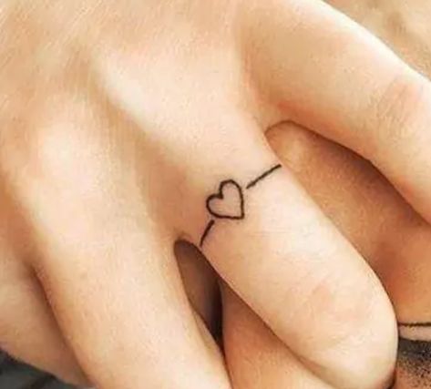 Ribbon Finger Tattoo, Wedding Ring Finger Tattoos, Hand Heart Tattoo, Little Heart Tattoos, Ring Tattoo Designs, Wedding Band Tattoo, Tattoo Finger, Ring Tattoo, Cute Couple Tattoos