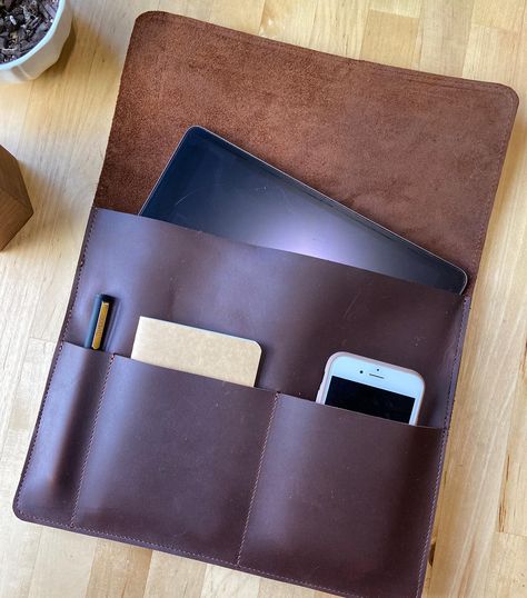 iPad sleeve now available on website!  Fits tablets that are 12” x 8.75” x .5” Extra pockets will carry your field notes and a phone up to 3” wide.Provides protection from minor falls. . . #ipadpro #ipadpromax #leatheripadcase #leatheripadsleeve #leathertabletsleeve #leatheripadbag #iphonecase #giftsforhim #giftsfordad #giftsforher #collegegifts #officegear #officegifts Leather Ipad Sleeve, Leather Ipad Case, Leather Laptop Case, Leather Wallet Pattern, Leather Journal Cover, Ipad Bag, Tablet Bag, Leather Jacket Style, Field Notes