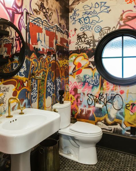 Bathroom with graffiti walls after renovation. Graffiti Bathroom, Real Estate Staging, Indoor Flowering Plants, Black Shower Curtains, Bathroom Transformation, Property Design, Bathroom Tile Designs, Atlanta Homes, Melissa Mccarthy