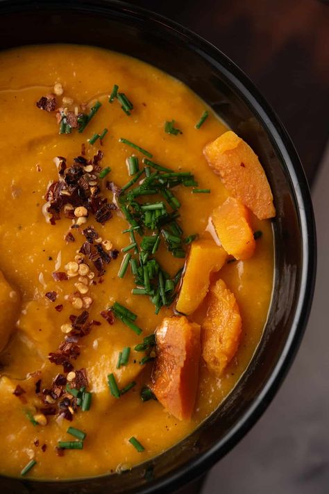 This simple spicy butternut squash soup is easy to make with everyday ingredients. Perfect for chilly fall days, its sweet and spicy taste delights. Try it with coconut milk, roasted sausage, or as a vegan option. Ideal for the crockpot or instant pot! Spicy Sausage Soup, Spicy Butternut Squash, Spicy Butternut Squash Soup, Roasted Sausage, Butternut Squash Soup Recipe, Roasted Red Pepper Soup, Butternut Squash Recipes Soup, Squash Soup Recipe, Roasted Butternut Squash Soup