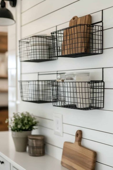 Stylish geometric wire baskets mounted on a rustic farmhouse kitchen wall for decorative storage. Kitchen Wall Baskets, Wire Basket Decor Kitchen, Wire Basket Decor, Boho Farmhouse Kitchen, Kitchen Wall Organizer, Kitchen Wall Decor Ideas, Farmhouse Kitchen Wall Decor, Farmhouse Kitchen Wall, Wall Decor Geometric