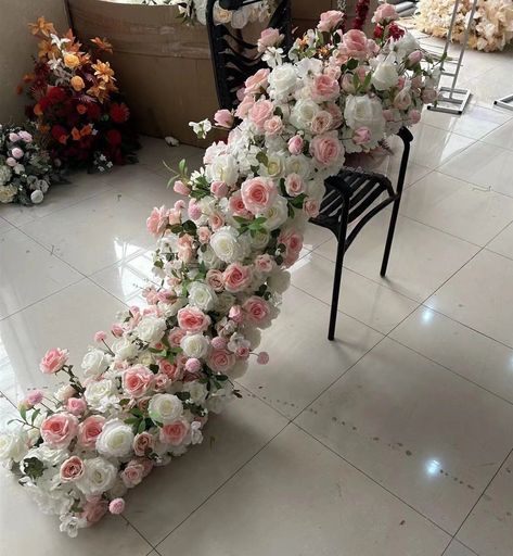 Accentuate your sweetheart table with this alluring flower garland. This flower table runner is available in a wide assortment of styles and in many sizes to perfectly fit vision of your special day. Stair Railing Decorations Wedding, Artificial Flower Arrangements For Table, Glamorous Centerpieces, Artificial Flower Arrangements Wedding, Table Flower Runner, Flower Runner Wedding, Garden Wedding Theme, Pink Wedding Details, Table Centerpiece Wedding