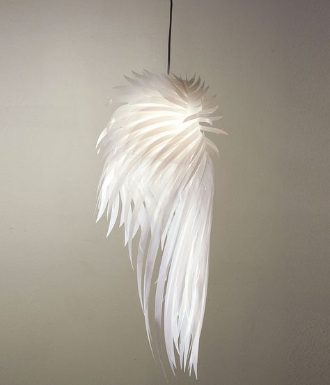 ICARUS LIGHT Go towards the light! Made from white mylar and multiple layers of polyester cut to resemble a hovering bird's wing, the Icarus Lamp is a striking homage to human aspiration and our source of life: the sun. Though its dimensions are 30" x 10" x 10", Icarus weighs just 1.5 pounds. The light is designed for a 60-watt bulb and comes with a conical safety protector. Electrical cord included. Icarus Wings, Tord Boontje, Light And Dwell, Feather Diy, Bedroom Minimalist, Flower Lamp, Fairy Light, Statement Lighting, Zaha Hadid